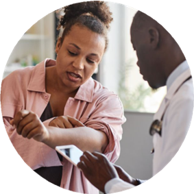 patient and doctor looking at skin